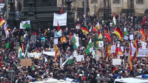 PEGIDA March in Dresden. Photo created by Kalispera Dell under a CC BY 3.0 licence. https://commons.wikimedia.org/wiki/File:PEGIDA_Demo_DRESDEN_25_Jan_2015_116227104.jpg